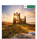 This blank card from the BBC Countryfile range features a photograph by Tatiana Hepplewhite showing the sun setting through windows of the ruins of Whitby Abbey, in North Yorkshire.
