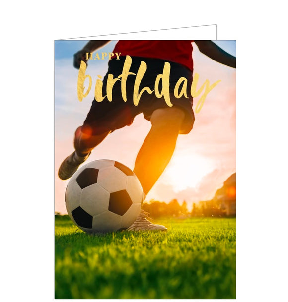 This birthday card is decorated with a photograph, taken from ground-level, of a footballer about to kick a football. Gold text on the card reads 