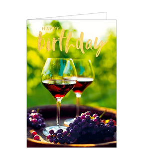 This birthday card is decorated with a photograph of two glasses of red wine and dark grapes ready to be enjoyed al fresco. Gold text on the card reads "Happy Birthday".