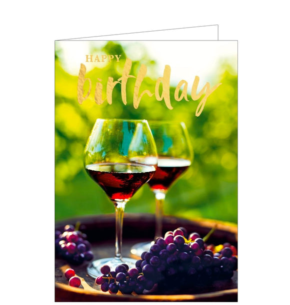 This birthday card is decorated with a photograph of two glasses of red wine and dark grapes ready to be enjoyed al fresco. Gold text on the card reads 