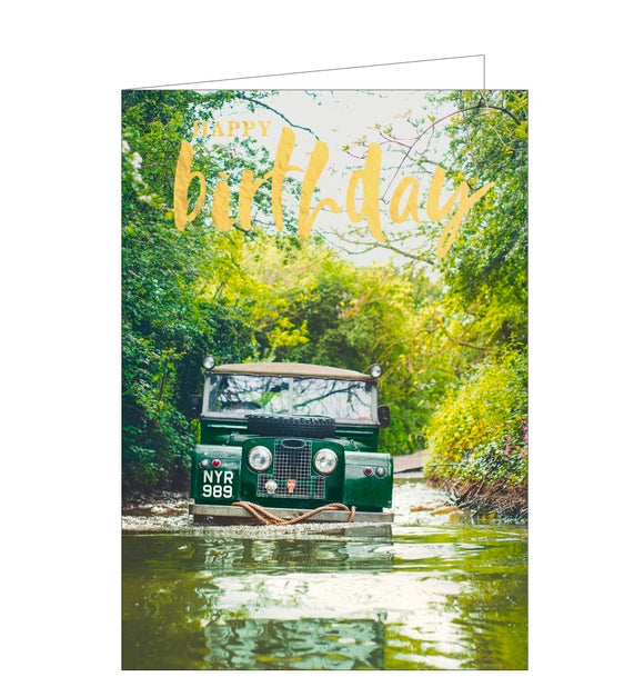 This birthday card is decorated with a photograph of a landrover 4x4 car driving across a flooded road, with a tow rope tied to the front bumper, ready to rescue stranded cars. Gold text on the card reads 