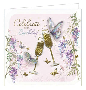 This Birthday card from Noel Tatt's Kimani range features an illustration of two embellishes butterflies fluttering around a pair of golden champagne flutes. The text in the corner of the card reads "Celebrate this Birthday".