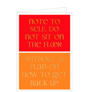 This contemporary and humourous birthday card is split into two complimentary red and orange boxes, overlaid with gold text that reads "Note to self, do not sit on the floor…without a plan to get up"