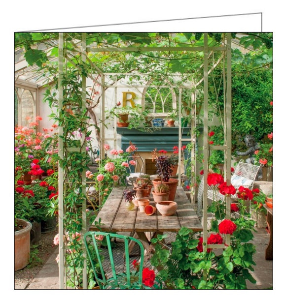 This blank card from the BBC Gardeners' World range features a photograph by Clive Nichols the conservatory of the Lodge at Burford in Oxfordshire - filled with plants and flowers.