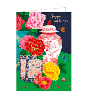 This stunning birthday card is decorated with a colourful butterflies fluttering around an arrangement of pots and flower heads. Gold text on the front of the card reads "Happy Birthday".