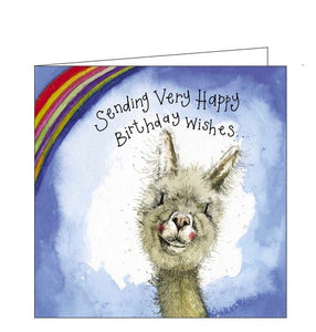 Part of Alex Clark's "Little Sunshine" greetings card collection. This birthday card is decorated with Alex Clark's illustration of a smiling alpaca in front of a rainbow. Gold text on the front of the card reads "Sending very happy Birthday wishes...."