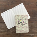 This 100-page notebook is decorated with a beautiful illustration by Alex Clark showing four garden birds perched on a tree blossoming with pink flowers  This notebook makes a feature of the classic stitched binding with an exposed spine.