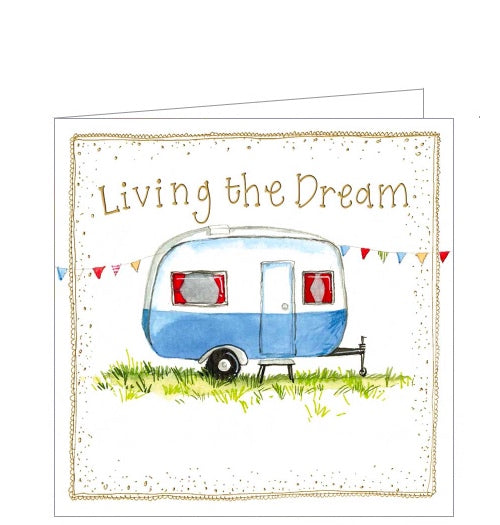 Part of Alex Clark's Little Sunshine collection, of smaller sized greetings cards. This card features lovely illustration of a small blue and white caravan with red curtains. Gold text on the front of the card reads "Living the dream".