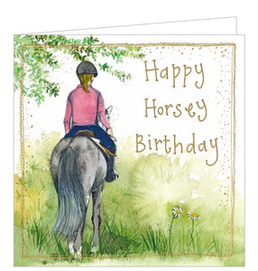 This lovely birthday card is decorated with Alex Clark's illustration of a girl riding her horse in the countryside. Gold text on the front of the card reads “Happy Horsey Birthday".