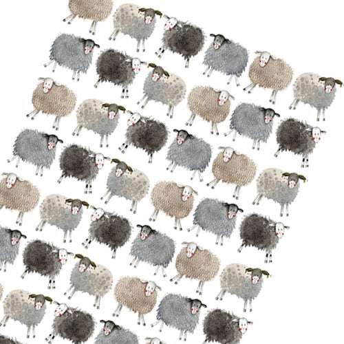 This Alex Clark wrapping paper features a repeating design of rows of smiling sheep.