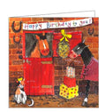 This farm-themed birthday card features artwork by Alex Clark of a horse in its stable. Another horse in a rug stands outside the stable with a pile of birthday presents. A banner above the stable reads "Happy Birthday to you!"