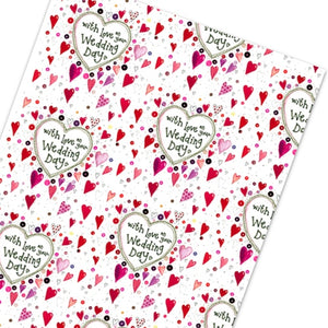 This Alex Clark wrapping paper features a repeating design of tiny red and pink hearts surrounding text that reads "with lot on your Wedding Day".