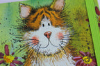 Official Alex Clark illustrated stationery range of an A6 notebook with toffee the cat on the cover, lined pages inside and polka dots on the back. Notebook is secured with an elastic band.
