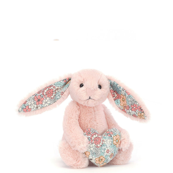 A gentle joy full of vintage snuggles, Jellycat's Blossom Heart Blush Bunny is peachy-perfect. This dreamy-soft bunny rabbit has long flower-print ears and a gorgeous heart to match. With a fluffy bobtail and petal-pink nose, this little pal makes a gorgeous gift, bouncing with understated sweetness!