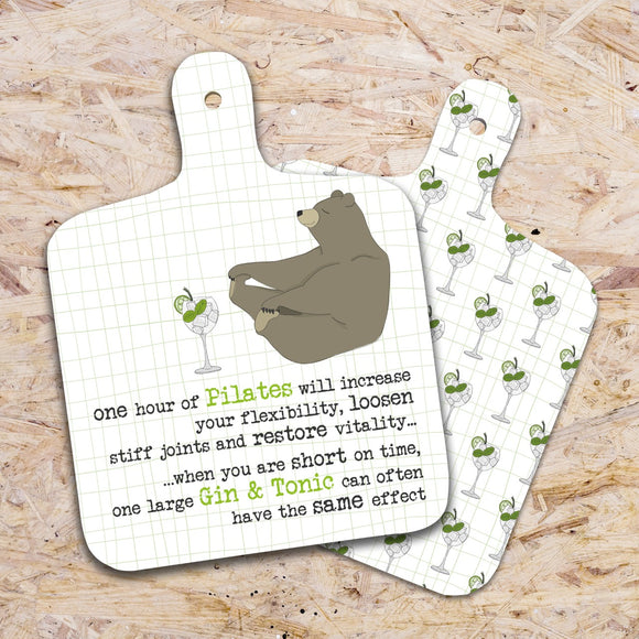This small chopping board from Dandelion Stationery is decorated with  a zen-looking brown bear touching its toes - and with a large glass of gin in front of the bear. The text on the front of the choppingboard reads 