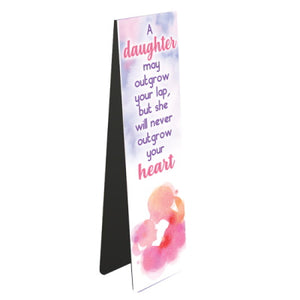 This magnetic book mark for a book-loving daughter is decorated with pastel clouds and the text that reads "A daughter may outgrow your lap, but will never outgrow your heart". 