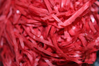 Red shredded tissue paper