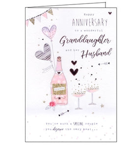 This wedding anniversary card for a special granddaughter and her husband is decorated with an illustration of a bottle of champagne and two fizzing coupes. Rose gold text on the front of the card reads "Happy Anniversary to a wonderful Granddaughter and her Husband...you're such a special couple you deserve the very best..."