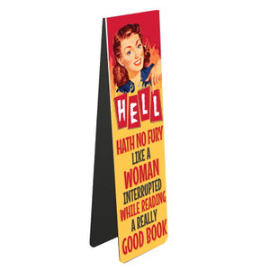 This fabulous magnetic bookmark is decorated with a retro-styled illustration of a woman standing against a background of flames. Bold red and black text on the book mark reads "Hell hath no fury like a woman interrupted while reading a really good book".