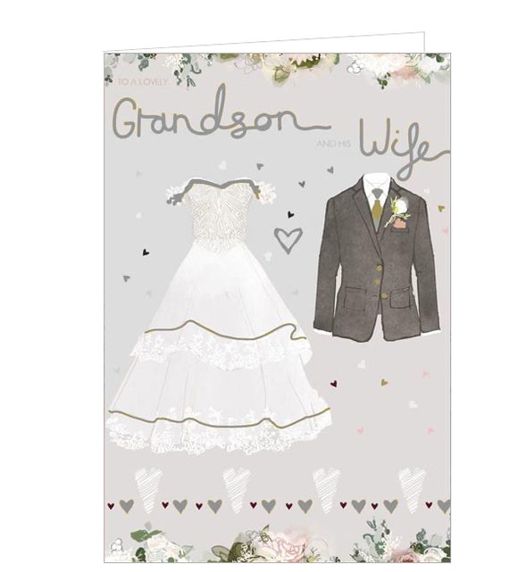  This lovely card for a grandson and his wife on their wedding day is decorated with an illustration of a glittery wedding dress and a suit, complete with boutonniere. Silver text on the front of the card reads 
