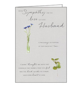 A beautiful, simple sympathy card to show the recipient that you are thinking of them at a difficult time. This sympathy card features silver text that reads "With sympathy of the loss of your Husband. A message of support at this difficult time.. caring thoughts are with you through the sadness that you feel, may the kind words of others help your heart to heal" along side a vase of blue flowers and foliage.