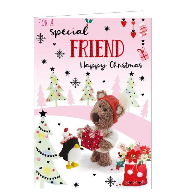 This lovely Christmas card is decorated with Barley the brown bear, wrapped up warm in a knitted hat and jumper, holding out a christmas gift for a penguin friend. The text on the front of the card reads 