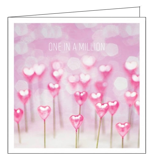 This cute and romantic greetings card is decorated with a photograph of rows of pink heartshaped pins. Text on the front of the card reads 