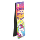 This magnetic book mark is ideal for young readers - or the young at heart. A unicorn with a colourful mane stands against a rainbow-sky. Text on the bookmark reads "Imagine Dream Believe".