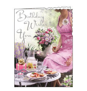 This birthday card is decorated with a table laden with delicate pink cakes and flowers. The text on the front of this Birthday card reads "Birthday Wishes to You".