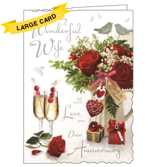 This large, luxurious anniversary card for a special Wife is decorated with with champagne flutes filled with fizz and garnished with red berries, next to a beautiful arrangement of roses. Silver text on the front of the card reads 