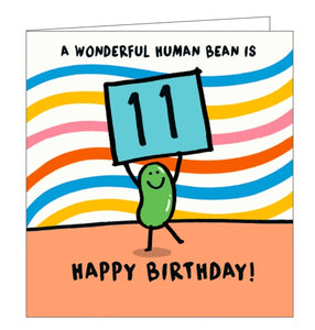 This 11th birthday card is decorated with a cartoon bean holding up a placard with a large "11" on it. The text on the front of the card reads "A wonderful human bean is 11...Happy Birthday!"