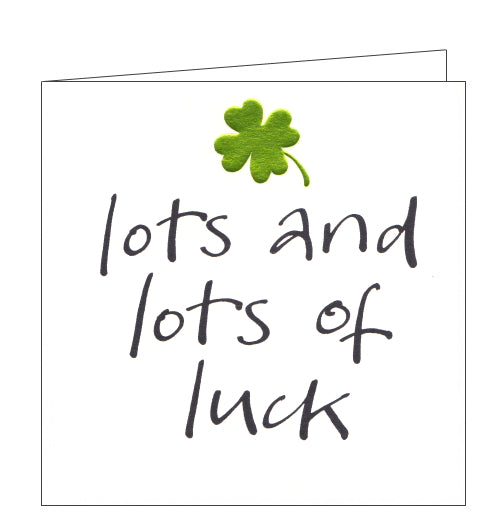This good luck card is decorated with an embossed metallic green four leaf clover above black brush script text that reads 