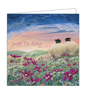 This lovely card features detail from an original pastel drawing by Lucy Pittaway showing a pair of sheep sitting together in a field of pink and purple flowers. The text on the front of the card reads "Just to say".