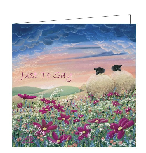 This lovely card features detail from an original pastel drawing by Lucy Pittaway showing a pair of sheep sitting together in a field of pink and purple flowers. The text on the front of the card reads 