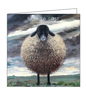 This greetings card features detail from an original pastel drawing by Lucy Pittaway, showing a very shaggy sheep standing in an atmospheric, grey-cloud covered landscape. Text on the top of the card reads "Just to say". 