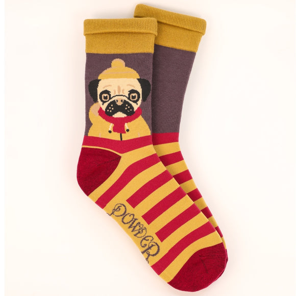 This pair of mens socks from fashion brand Powder are decorated with an amazing design of a pug dog in a yellow macintosh and matching hat. These socks are knitted in a retro colour palette of mustard yellow, heather purple and pink.
