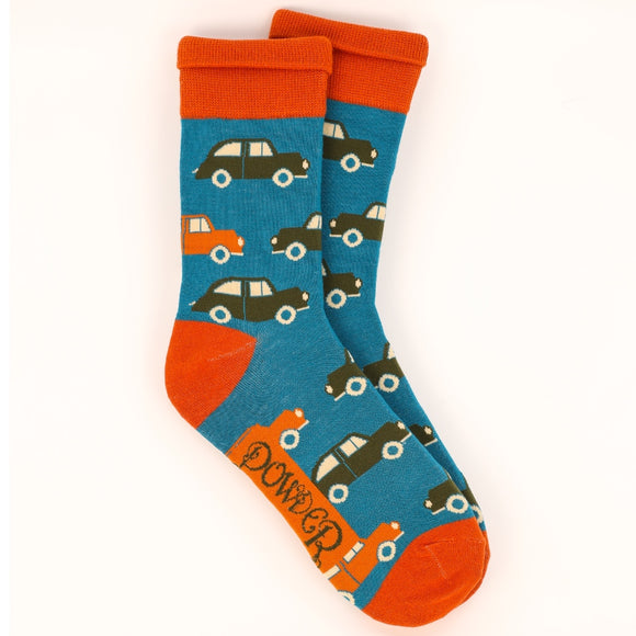 This pair of mens socks from fashion brand Powder are decorated with a repeating patterns of vintage cards. These socks are knitted in a retro-colour palette of blue, orange and khaki green.
