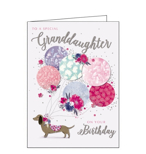 This lovely birthday card for a special Granddaughter is decorated with an illustration of a little sausage dog in a pink patterned coat, with a collar of flowers. Tied to the dogs collar is a huge bunch of pink, purple and blue balloons. Text on the front of the card reads 
