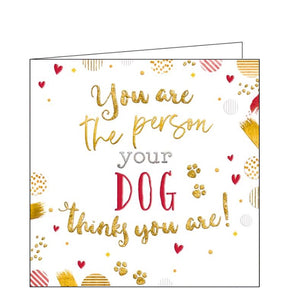 This cute little card is decorated with metallic and glittery hearts and pawprints. Metallic, gold and red text on the card reads "You are the person your dog thinks you are!"