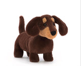 Tiny legs and a great big heart - that's Jellycat's Otto Sausage Dog! This intrepid pup is divinely dinky in dark chocolate fur with caramel patches. With waggly ears, a perky tail, golden eyebrows and sassy spirit, bright-eyed Otto's a playful little pal!