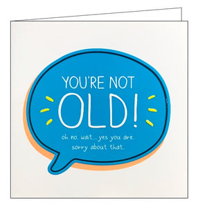 This birthday card from the fun Happy Jackson card range, features bright backgrounds and contrasting text. White text in a bright blue speech bubble reads "You're not OLD! Oh no, wait...yes you are. Sorry about that."