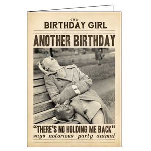 This birthday card from Pigment Productions Fleet Street range, designed to look like a vintage newspaper called "Birthday Girl", complete with a sepia-toned photograph of a woman asleep on a park bench. The caption on the front of the card reads "'There's no holding me back' says notorious party animal."