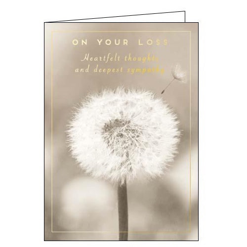 This sympathy card id decorated with a sepia-toned photograph of a dandelion flower. Gold text on the card reads 