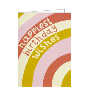 This lovely birthday card is decorated with a close up of a rainbow in pinks and yellows. Text on the front of the card reads "happiest birthday wishes".