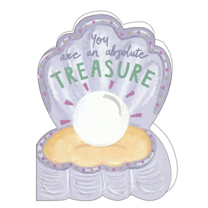 This lovely birthday card is die cut into the shape of an open shell with a pearl at the centre. Shiny metallic text on the front of the card reads "You are an absolute treasure".