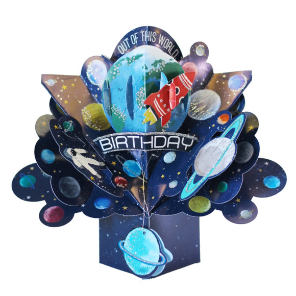 This space themed pop-up 3D keepsake card is decorated with glittery planets and stars as a rocket flies through space. Text on the card reads 