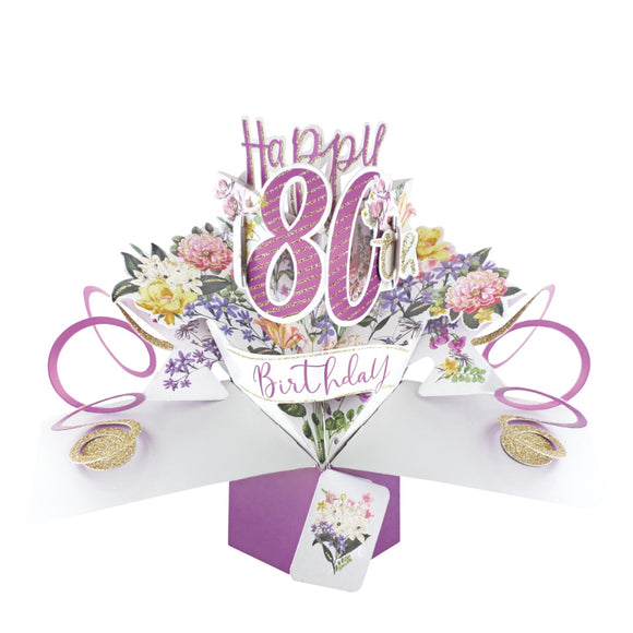 A spectacular pop-up 3D keepsake 80th birthday card, that opens to unleash pink streamers, delicate flowers and text that reads 