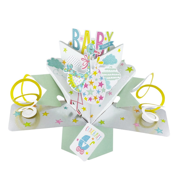 This 3D baby shower card is decorated with a stork carrying a baby wrapped pink, yellow and blue star print blanket. Text on the card reads 