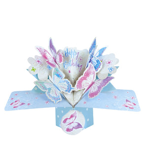 Pop-up 3D birthday card that opens up to reveal a kaleidoscope of blue and pink butterflies. Text on the card reads "Happy Birthday".