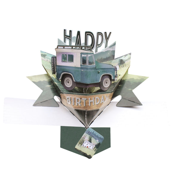 Pop-up 3D keepsake card shaped like a green and white classic landrover 4x4 card, out in the mountains. Text on the front of the birthday card reads 